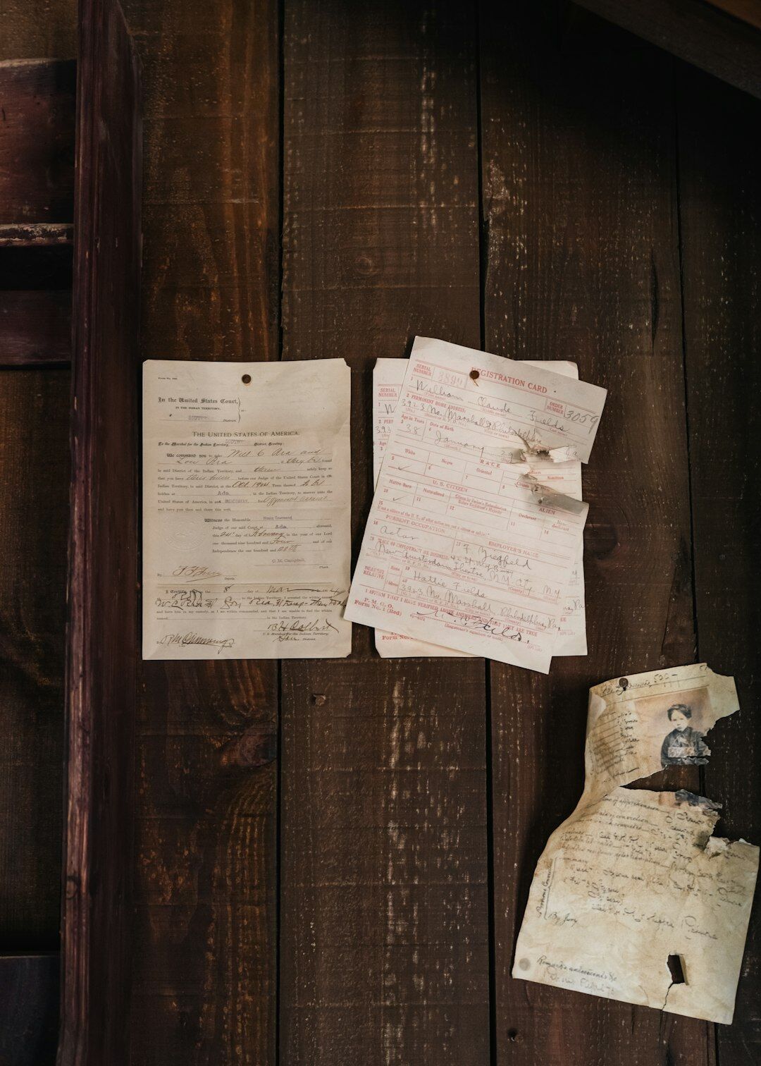 Old archive room with wooden filing cabinets and stacks of dusty folders