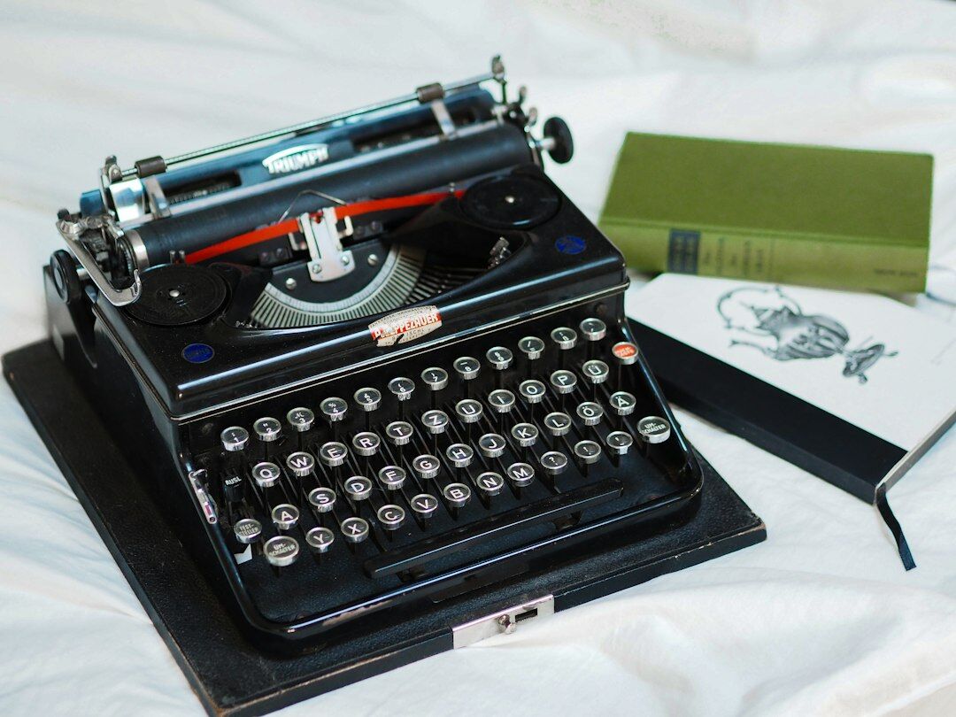 Vintage typewriter with an open manuscript of a detective novel
